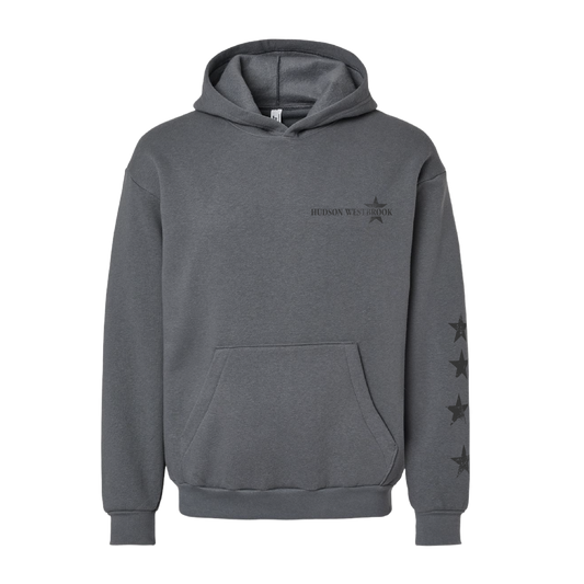 Gray hoodie with star designs on sleeves and text on chest against a white background